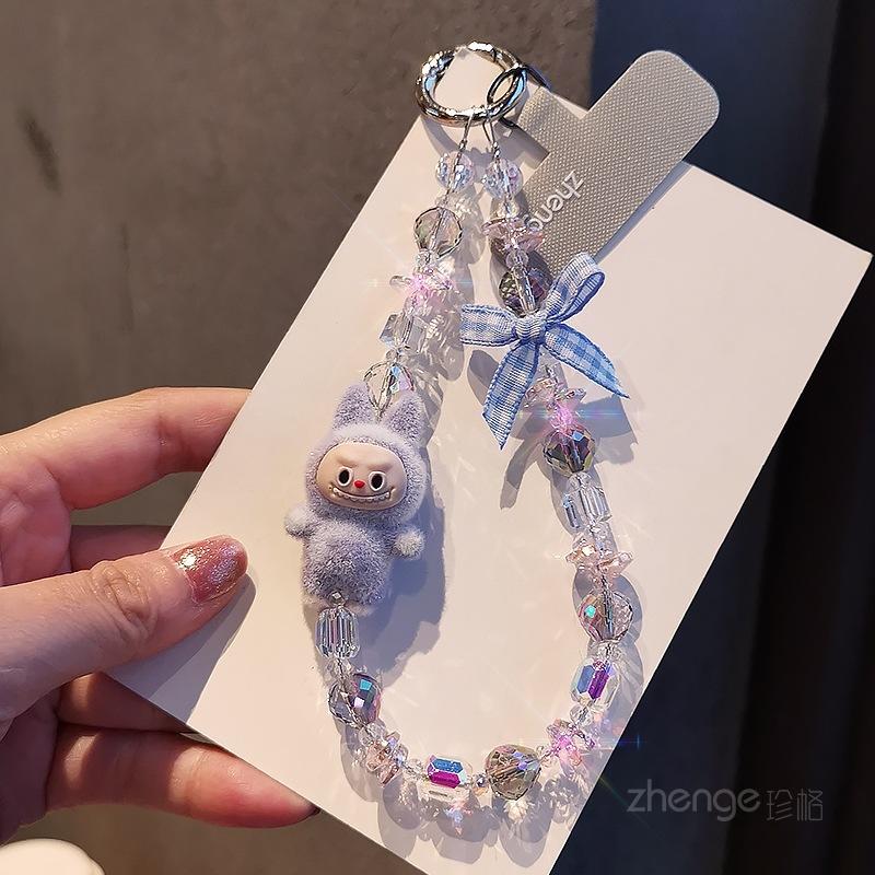 

Mobile phone lanyard flocking elf doll bow crystal bracelet female ins cartoon cute beaded pendant short [blue purple]