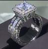 Bague de mariage Super brillante pour hommes et femmes, couleur argent exquise, pierres de Zircon incrustées, bijoux de fiançailles