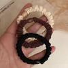 Versatile Black Elastic Hair Tie with Durable Leather Case