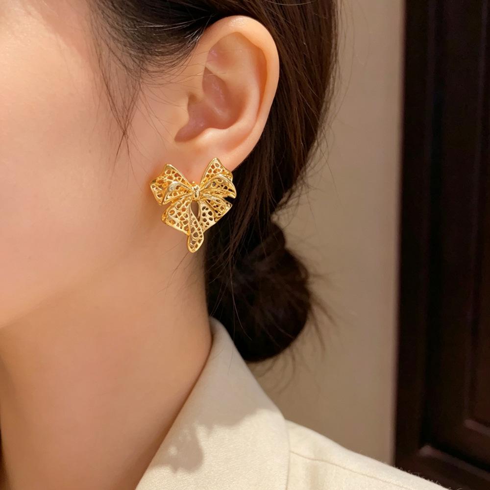 Chic Metal Hollow Bow Earrings: Unique European & American Cool Style