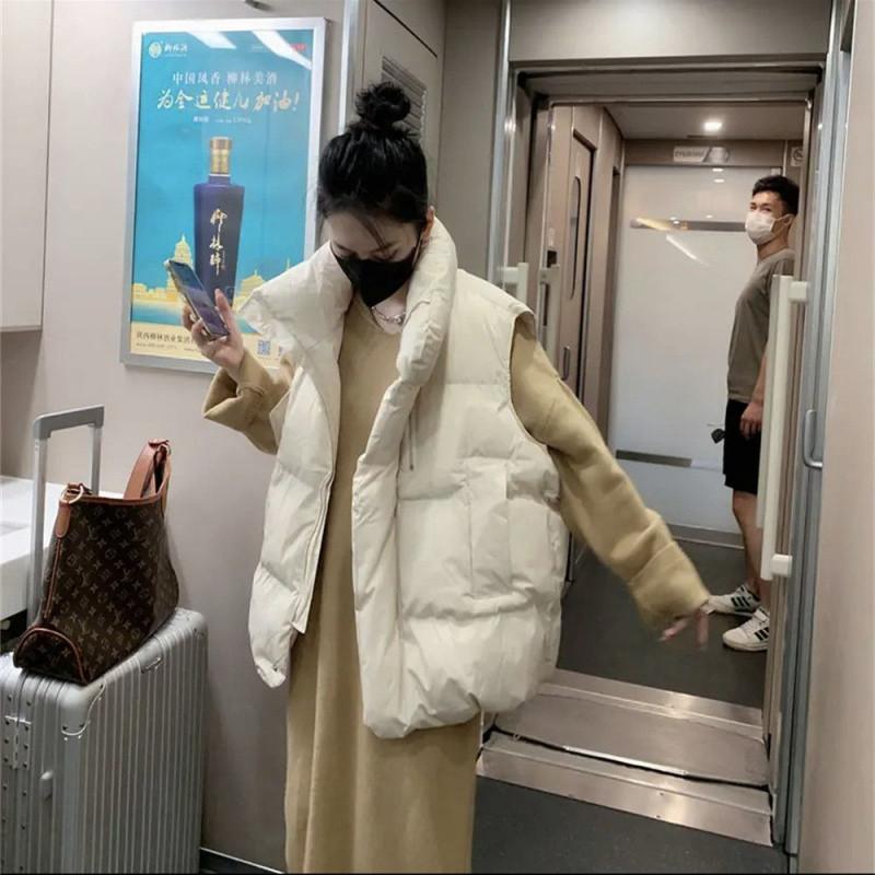 Dámská vesta z prachového peří