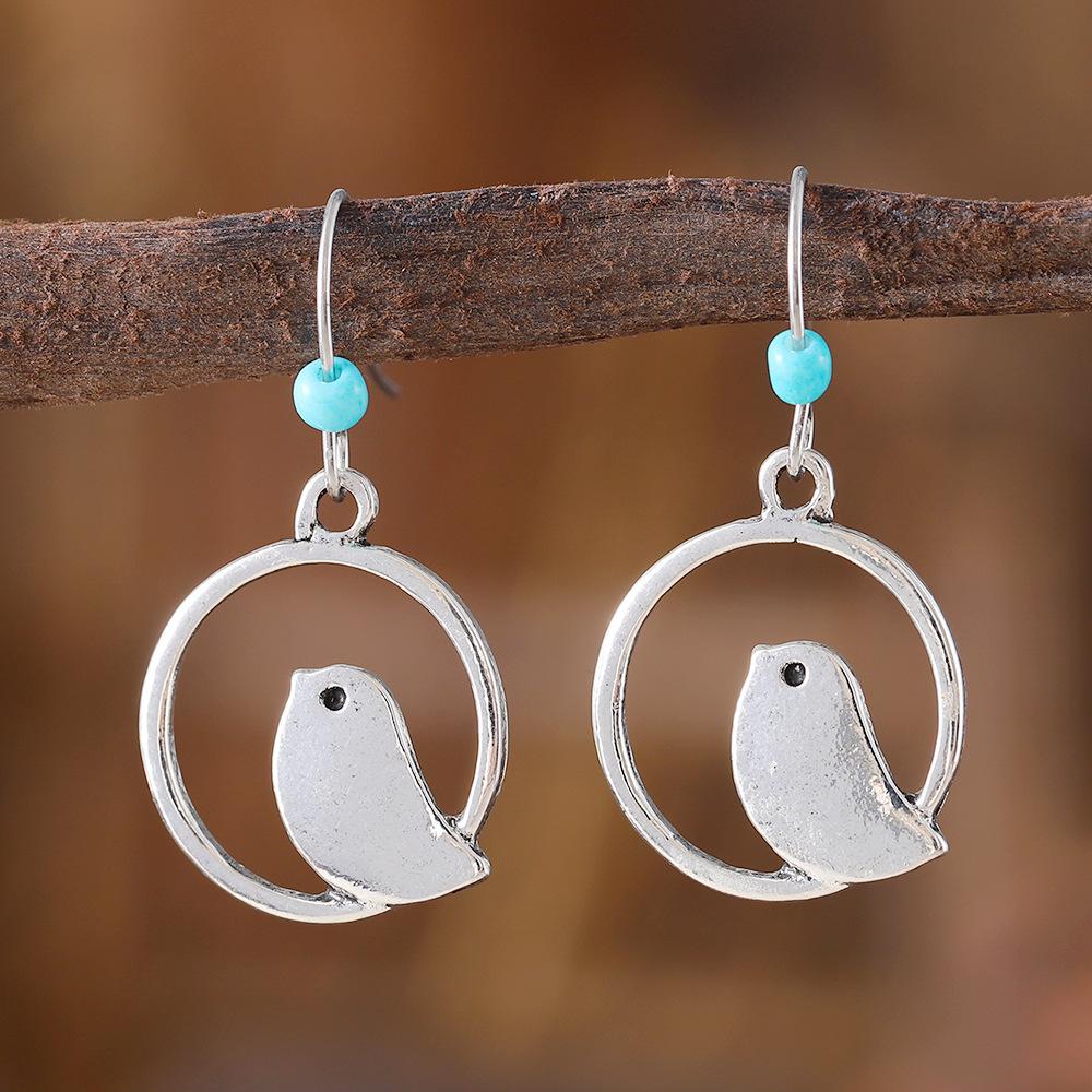 

Retro Sapphire Round Hollow Bird & Bohemian Niche Earrings