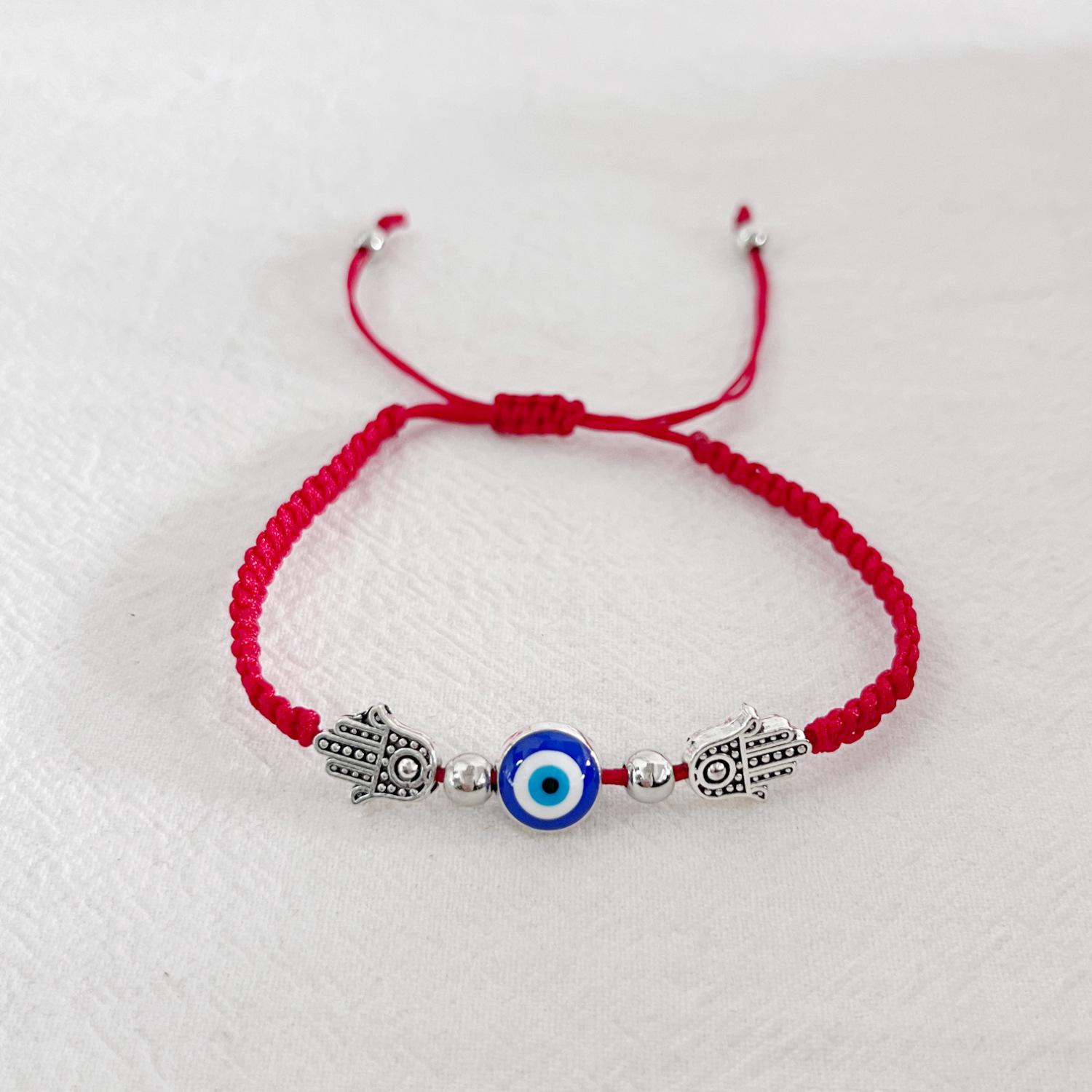 Два круглых бусины на ладони Синие глаза Глаза от сглаза Красная веревка Регулируемый браслет