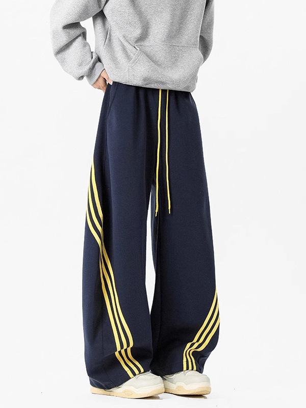Pánské tmavě modré široké tepláky se třemi pruhy - Ležérní jarní high street trend