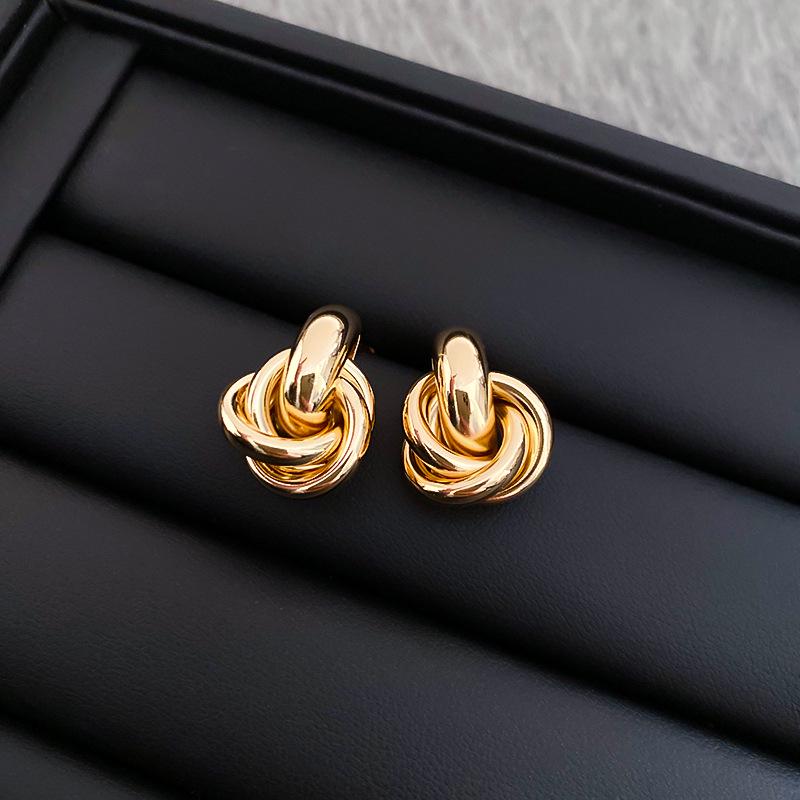 

Silver Needle Coiled Metal Stud Earrings - Luxury, Fashionable Design Ear Accessories for Women.