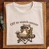 Cute Raccoon Soccer Shirt – Funny “Off To Watch Soccer” Camping Chair Tee for Fans.