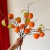 Persimmon Artificial Flower Arrangement: New Year Decoration with Red Fruit Accents for Living Room.