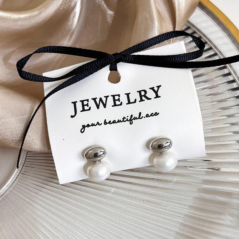 

Овальні металеві сережки легкі розкішні високоякісні сережки з відчуттям жіночності сережки з новим модним нішевим дизайном срібний