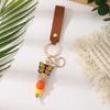 European & American Sweet Butterfly Daisy Silicone Beaded Keychain with Leather Bow Pendant