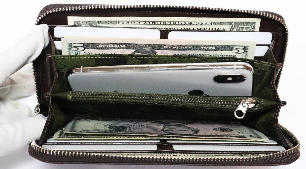 Brown crocodile-embossed wallet for men and women, made from a single piece of genuine alligator leather. Features include a round zipper closure,