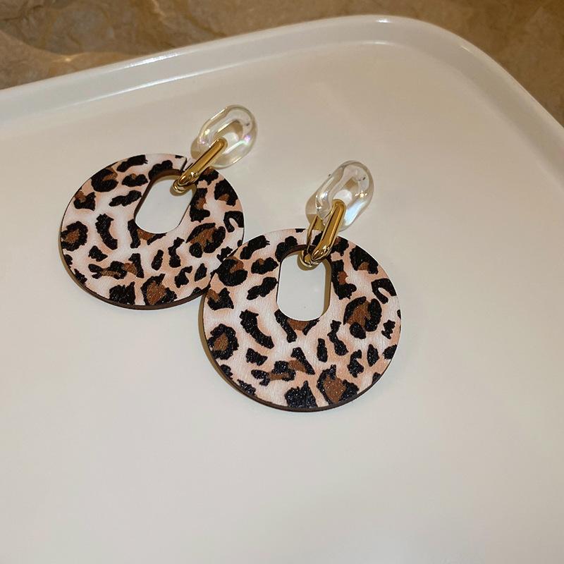 

Leopard print cross, ear hook, personality exaggerated earrings, niche design, high-end temperament earrings.