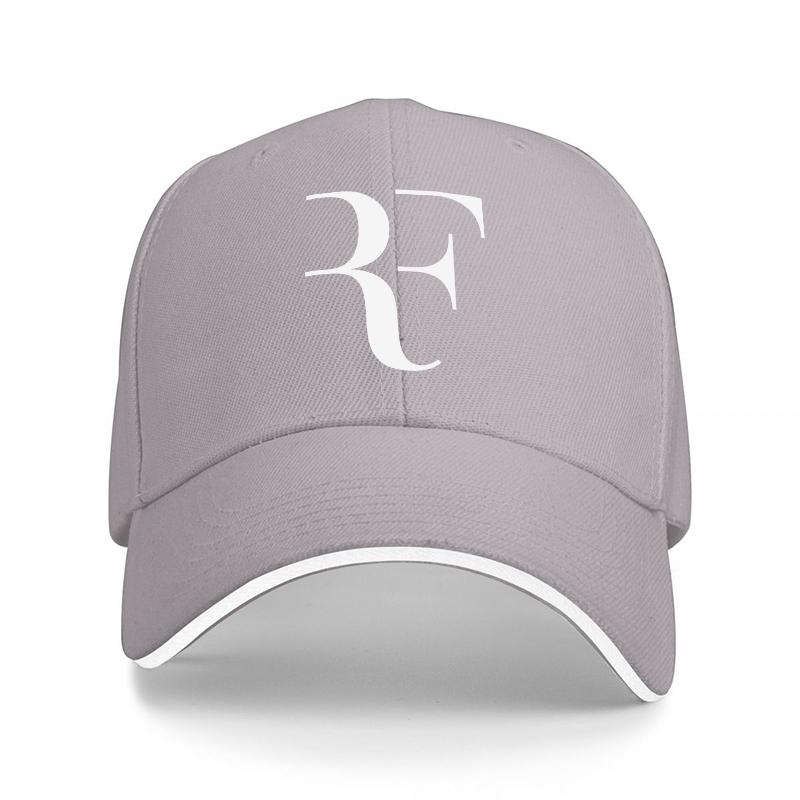 Svart basebollkeps med RF-logotyp och vita detaljer, klassisk design för unisex och kvinnor, modern streetwear-accessoar