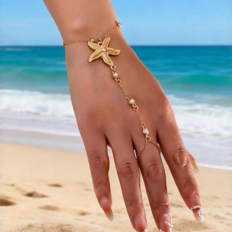 Starfish Pearl Gold Connected Finger Bracelet - Unique Design Chain Accessory for Girls, European and American Fashion.