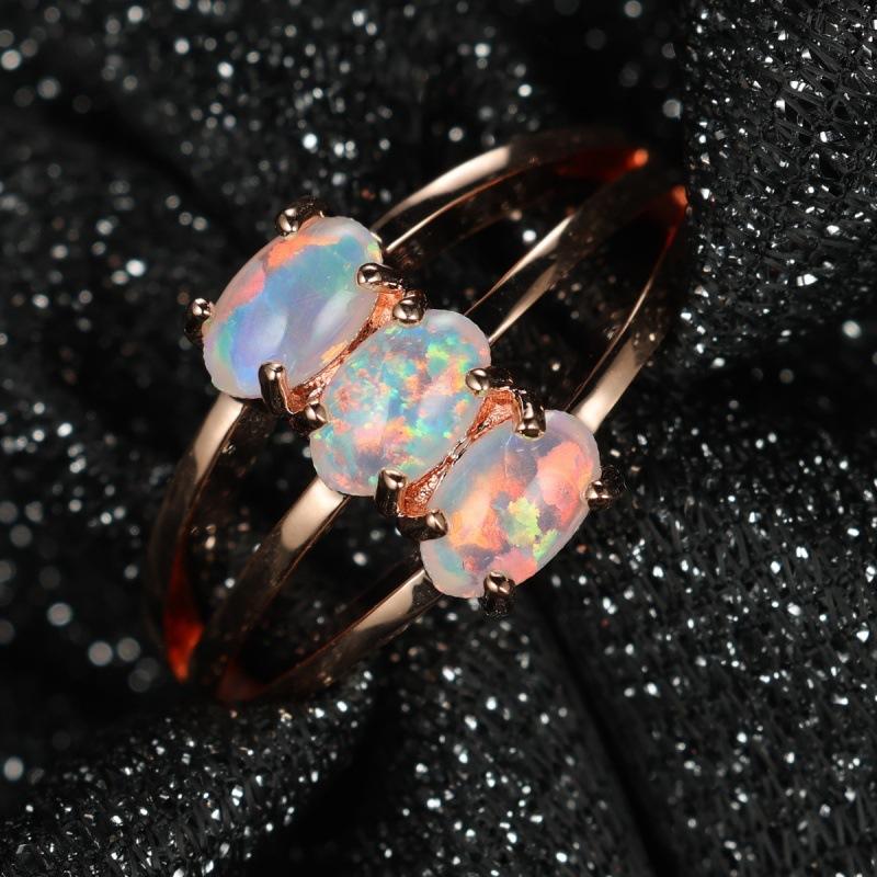 Hot-selling three-layer four-claw inlaid Opal OPal ring temperament simple personality unique ring