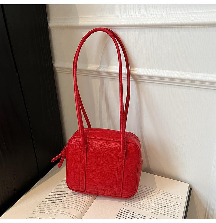 Retro niche portable bowling bag 2025 spring and summer new solid color shoulder bag temperament simple handbag