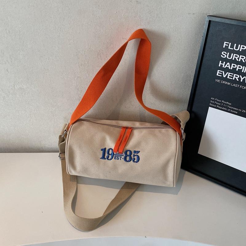

Spring and summer new niche canvas cylinder bag women s fashion casual versatile commuter shoulder messenger bag tide хаки