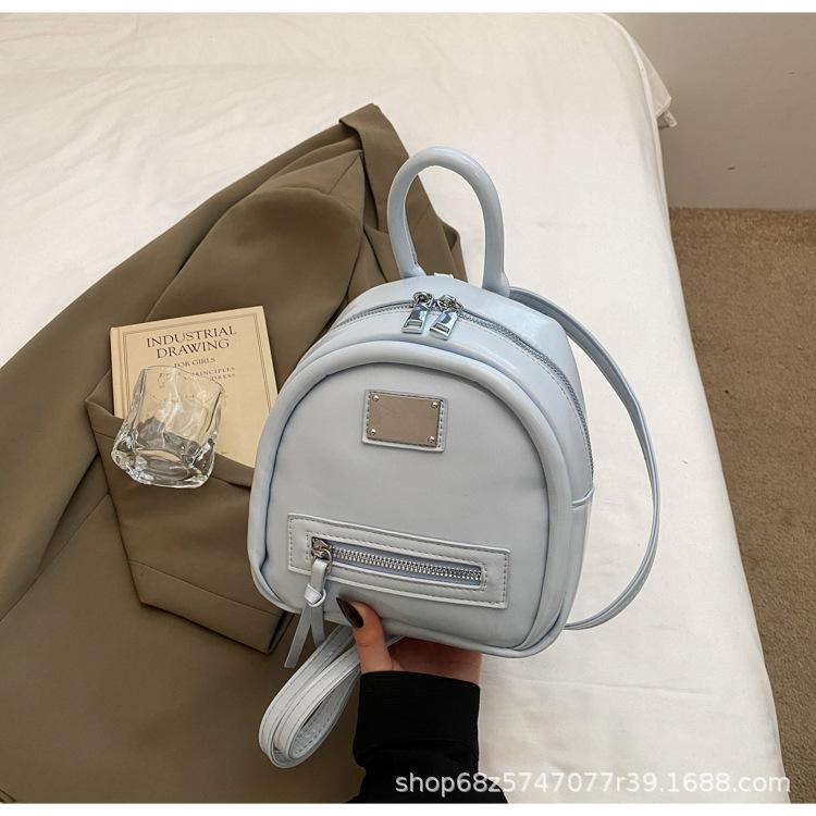 

Korean version of fashion commuter bucket bag simple backpack bag women s 2025 summer new lightweight niche design backpack синий