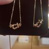 Collier avec Boucle Fer à Cheval Plaqué Or 18 carats avec Demi-Diamant et Corde en Chanvre - Disponible en Taille S/L