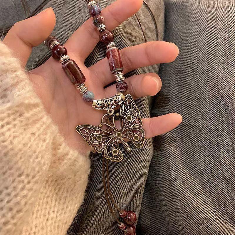 Retro pendant, ethnic style ceramic butterfly bell necklace, women's new trendy long sweater chain with accessories