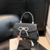 Fashion and simple temperament bow handbag 2025 summer new foreign style shoulder crossbody small square bag