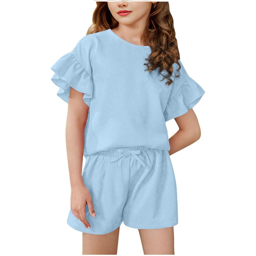 A Two-piece Set Of A Light, Solid-color Casual Sports Top With Ruffled Short-sleeved Round Neck And Shorts For Medium And Young Children In Summer