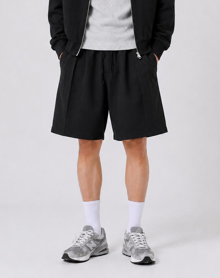 Mugeon Double-Pleat Curved Sweat Shorts _ Black