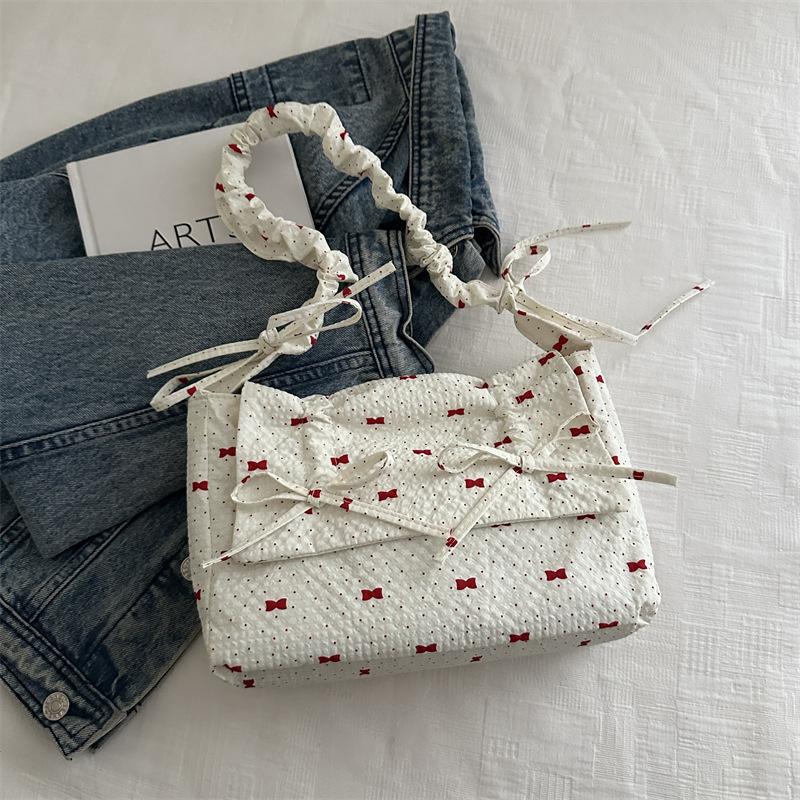 

2025 новая плиссированная сумка женская высококлассная сумка-мессенджер через плечо с бантом модная универсальная портативная сумка-облако для поездок на работу белый