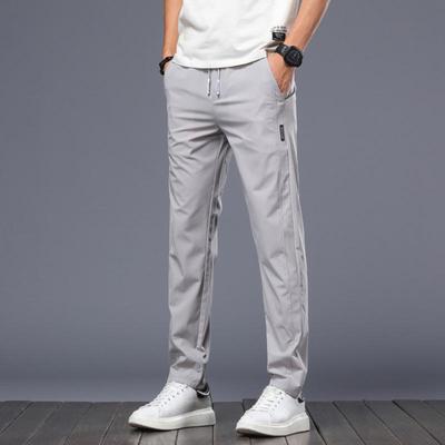 Men's Slim Fit Elastic Ice Silk Casual Pants - Smooth, No-Iron, Trendy Korean Style for Spring/Summer.