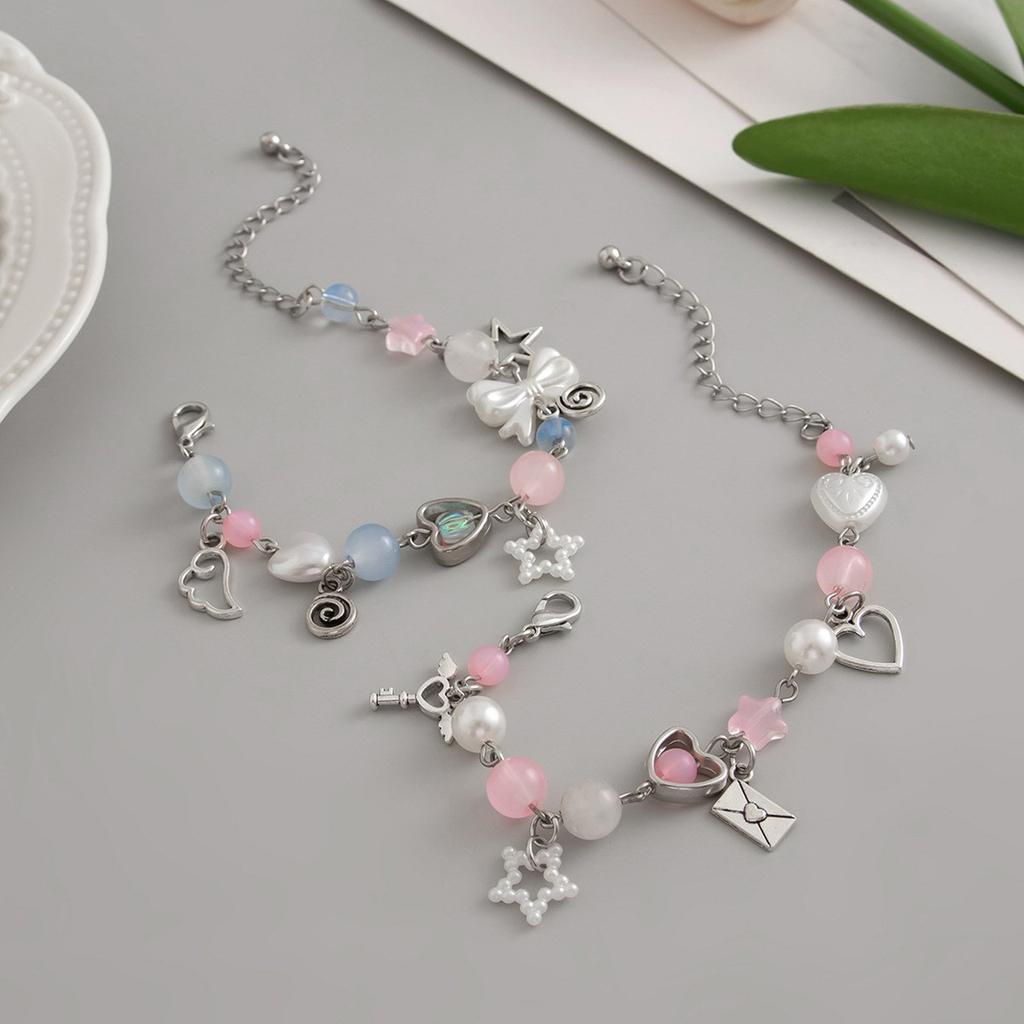 Bowknot Tassel Bracelet with Faux Pearl Accents Fashionable Bowknot Tassel Bracelet for Girls Showcasing Elegance