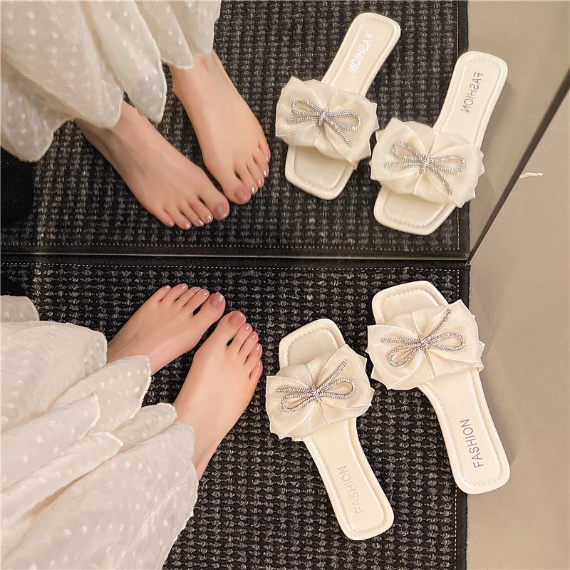 2025 summer new Internet celebrity bow flat bottom one word cool slippers women's shoes wear fashion versatile ins tide