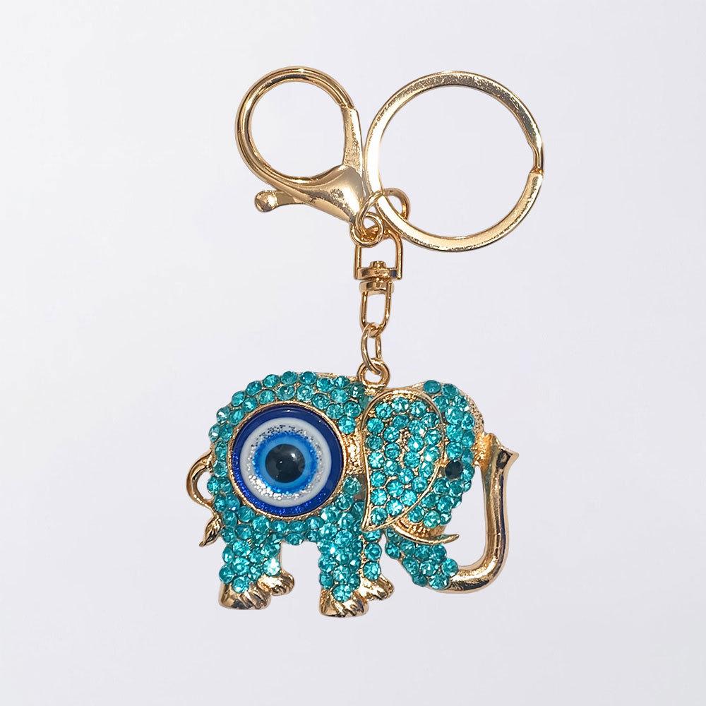 Neuer Schmuck mit blauen Augen - Diamantbesetzter metallisch farbener Elefanten-Schlüsselanhänger, Dämonenaugen-Anhänger