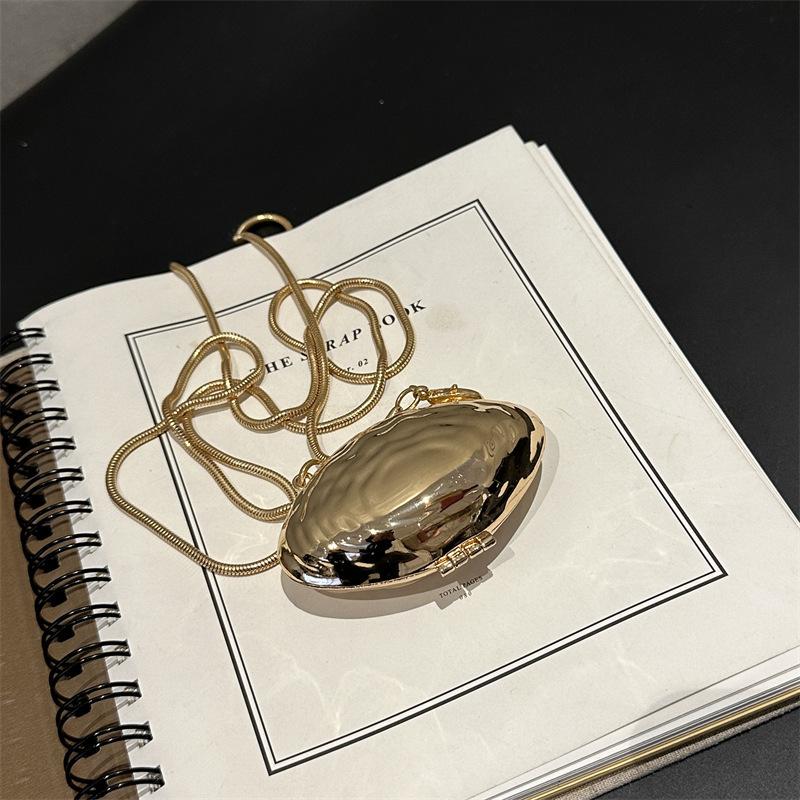 

Chain metal silver oblique decorative design small bag trendy shell bag portable back chain European and American style body style niche messenger
