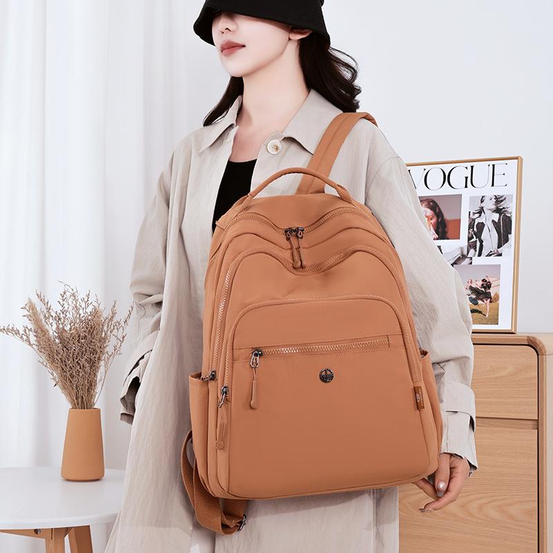 Zaino impermeabile per la scuola zaino da donna 1011 nuovo grande capacità borsa per studenti da viaggio all'aperto zaino leggero per il tempo libero per il pendolarismo zaino per computer