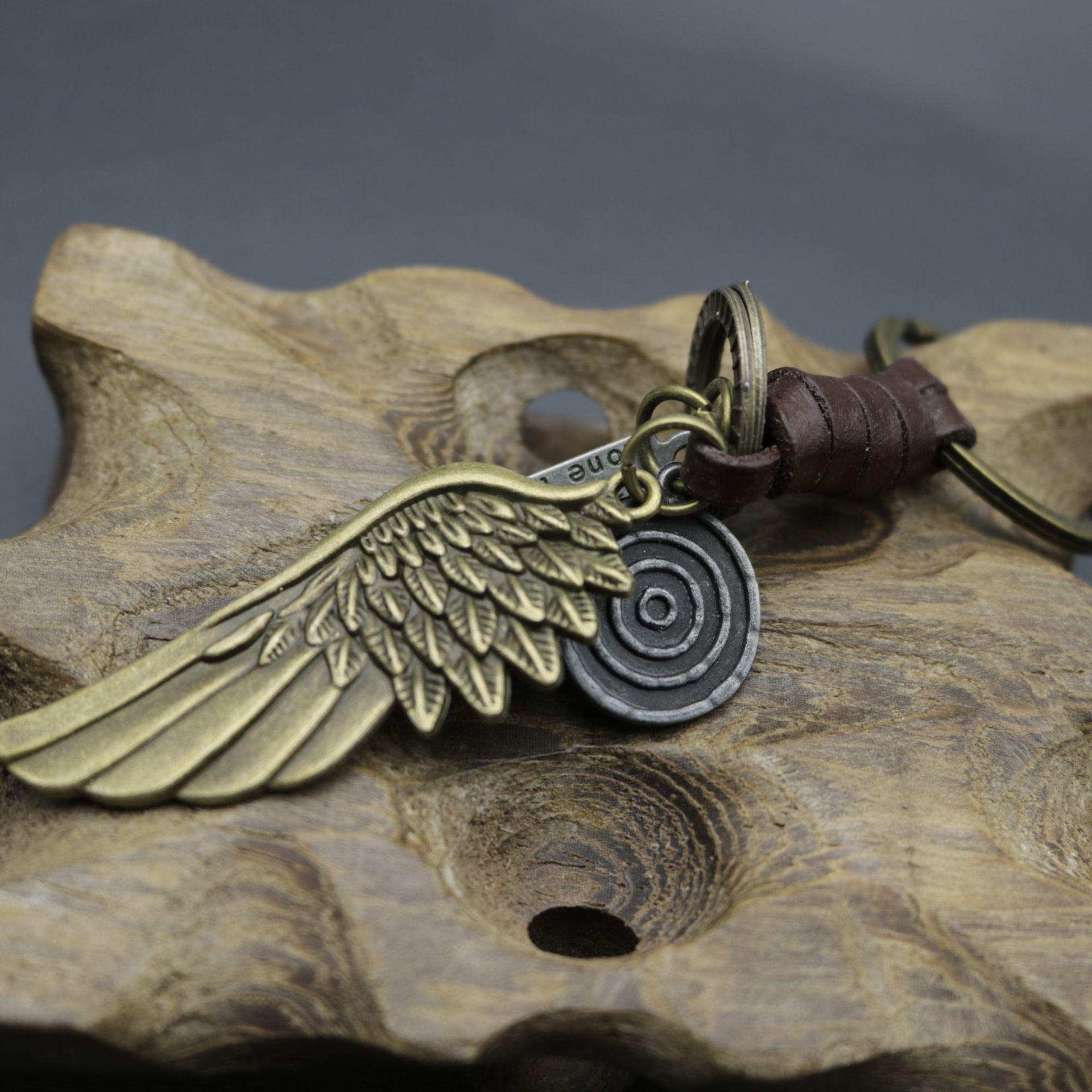 Men s Antique Bronze Wing Keychain with Woven Leather Pendant