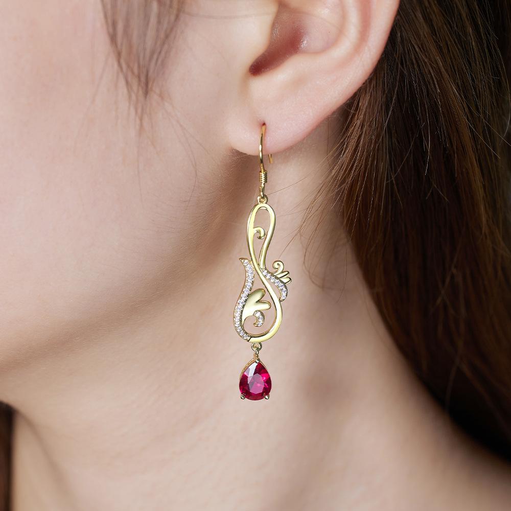 

Light luxury Tang grass pattern earrings, high-end antique zircon accessories, long Internet celebrity earrings 925 925 silver золотой