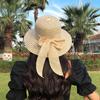 Women's Korean-style straw hat with large brim and bow, face-shading sun hat for outdoor beach use, UV protection, sun-proof straw fisherman hat