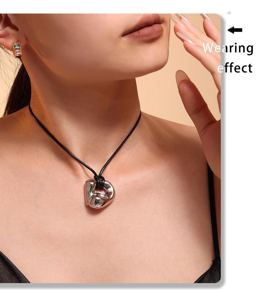 Qiong Yao Stainless Steel Curved Pendant Necklace with Black Leather Cord, Adjustable Length, Simple High-End Design for Women.