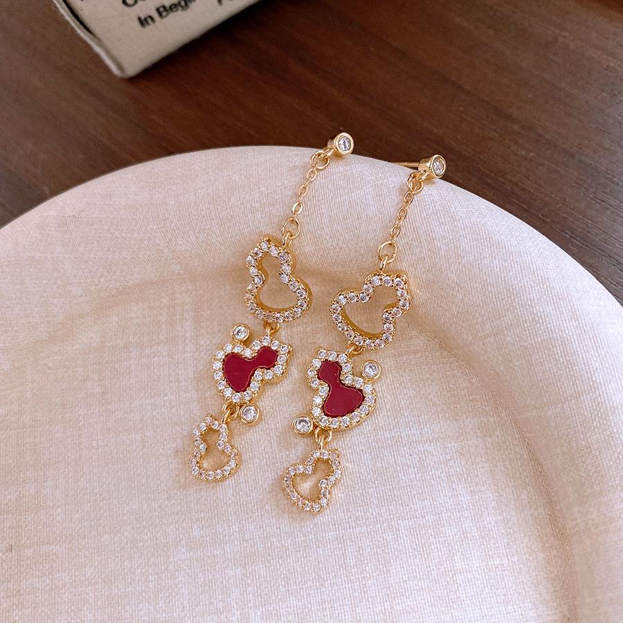 

18k real gold zircon gourd fringed earrings, earrings and earrings.