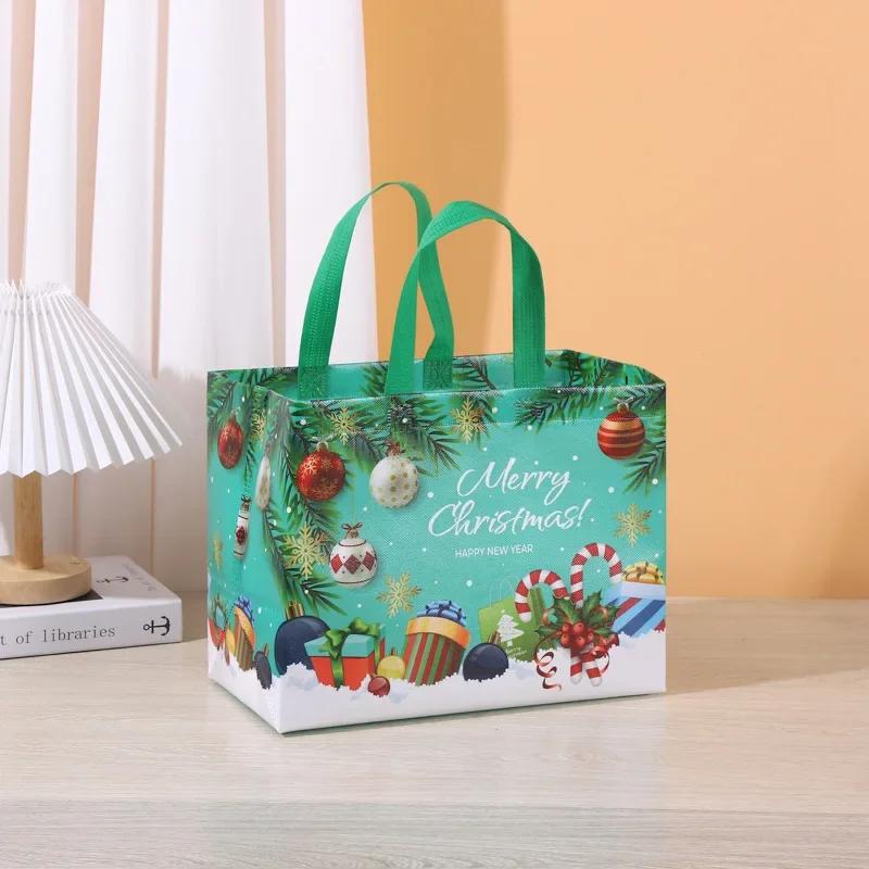 

Новинка в Різдвяних подарункових сумках Мультяшний милий Санта Олень Сніговик Друк Не ткана сумка Гаряче тиснення Партійні товари Прикраси 32x25x17cm