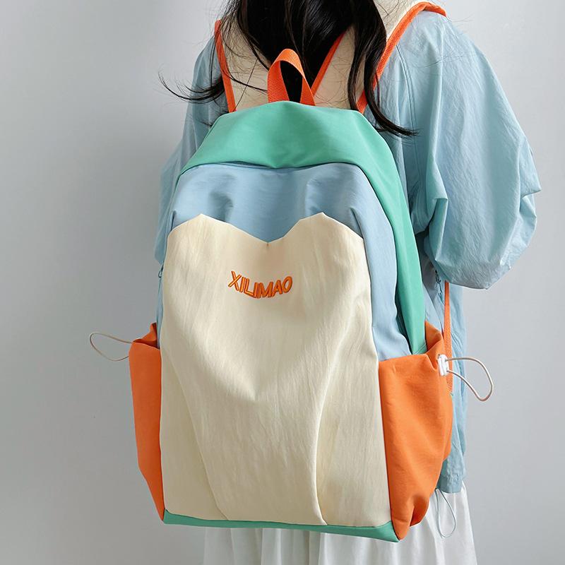 Casual backpack junior high school female student schoolbag ins large capacity couple travel backpack high value contrasting color backpack