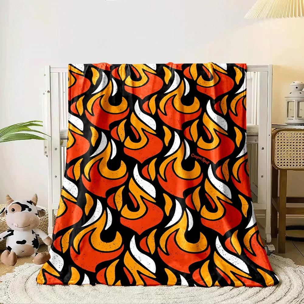 A bold repeating flame pattern in orange, yellow, and white on black. for all seasons blanket lunch break throw gift 80cm x 120cm