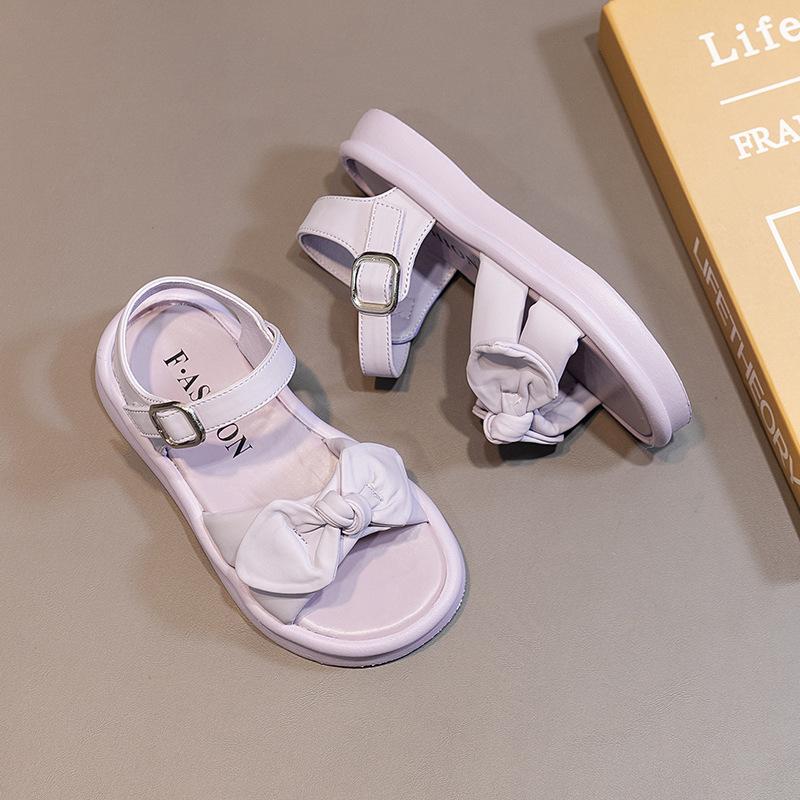 

2024 Детские сандалии для девочек Новые летние туфли принцессы с бантом для пляжа Модные детские повседневные школьные сандалии Универсальные однотонные 26 фиолетовый