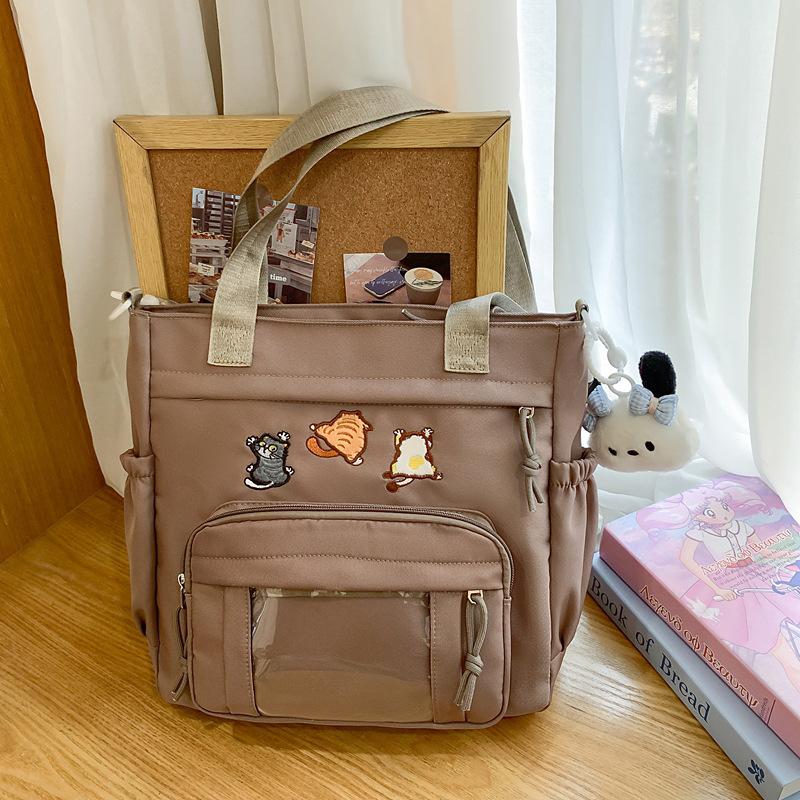 Cute messenger bag women's 2025 new Japanese pain bag large-capacity shoulder bag girl junior high school student portable tote bag