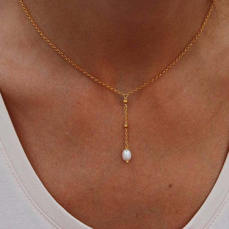 

Trendy Pearl Tassel Necklace - Elegant & Versatile Design золотой
