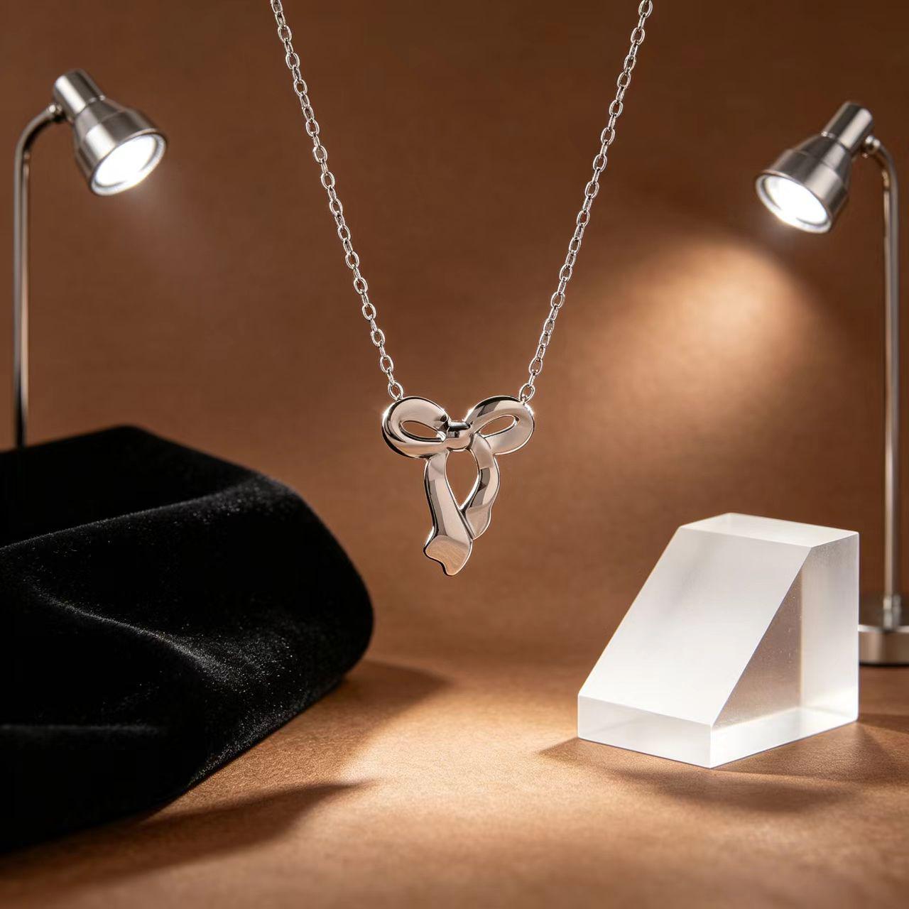 Stainless Steel Bow Pendant Necklace: Women s Light Luxury High-End Titanium Steel Jewelry. 18K