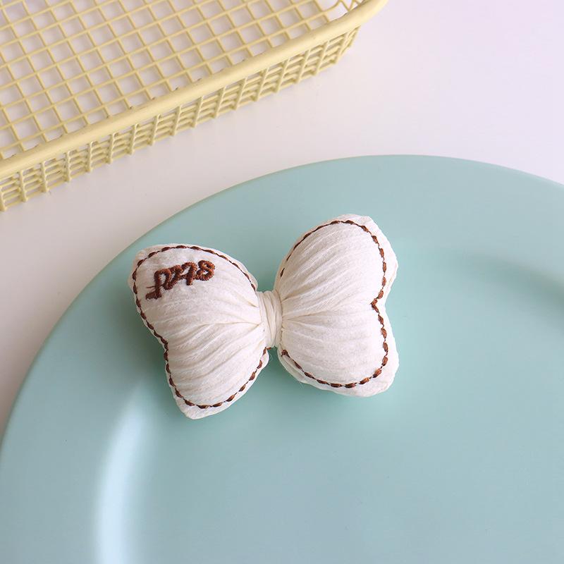 

Красочная ткань с вышивкой в виде бантиков для детской одежды своими руками