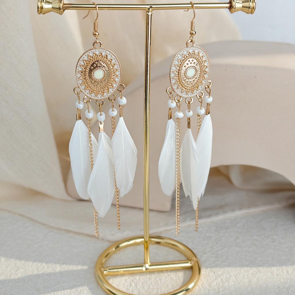 Retro ethnic style woven feathers long fringed earrings, bohemian high-end hollow rice bead earrings