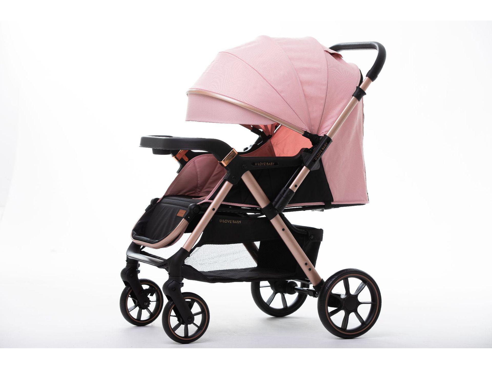 

Реверсивная четырехколесная детская коляска с капюшоном и подносом розовый