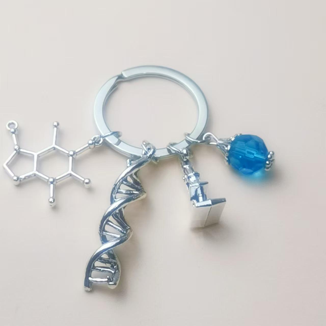 

Європейсько-американський біохімічний інструментальний мікроскоп і колба брелок підвіска шарм