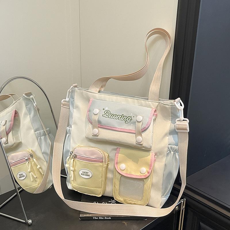 

Autumn and winter new tutoring bag high value portable college style small fresh tutoring bag student messenger bag світло-синій колір